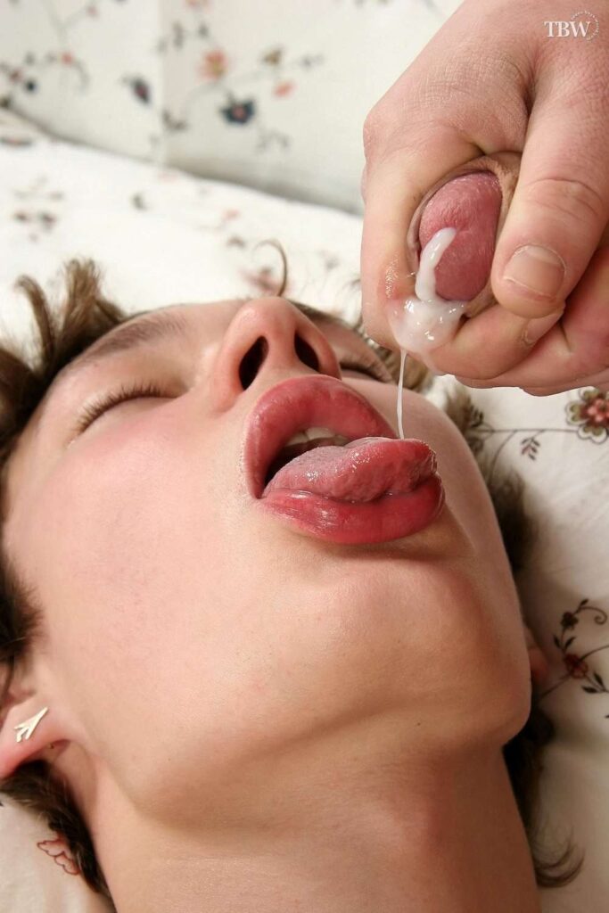 Gay twink drinking cum